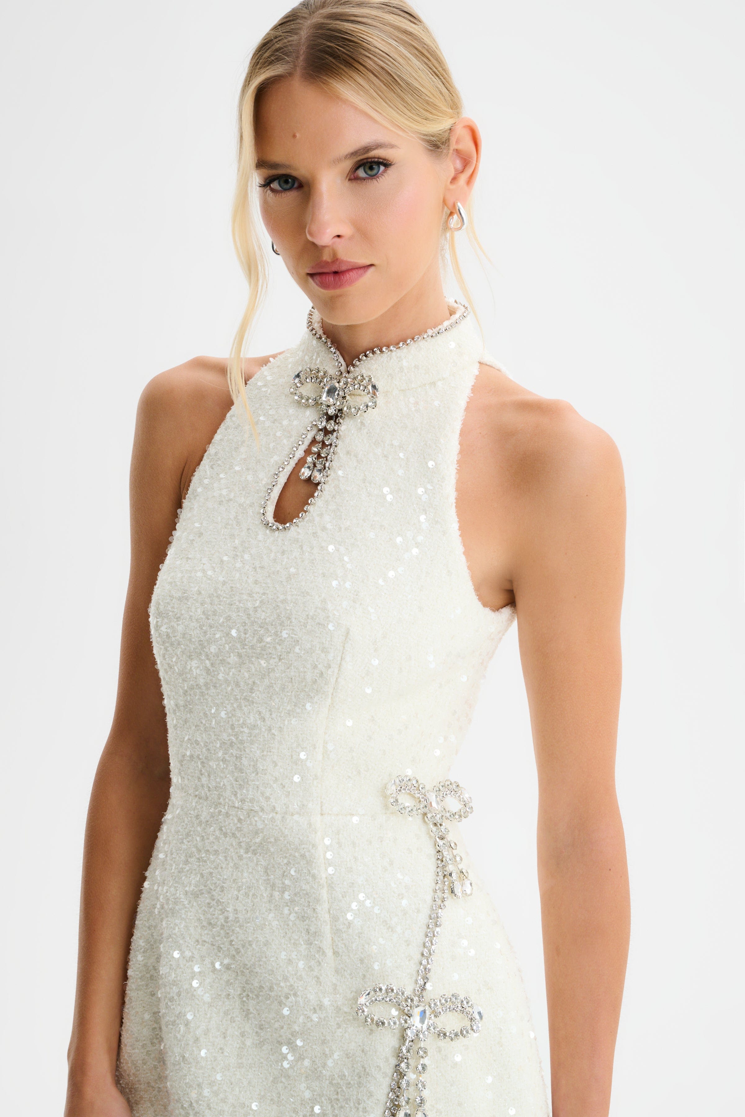 SOLENE Sequin Boucle High Collar Mini Dress with Bow Embellishment in Beige